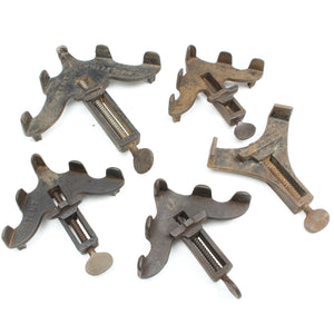 Set of vintage metal clamps on a white background