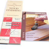 Two books on wood finishing on a white background