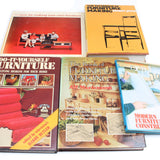 Collection of books on furniture making and design on a white background