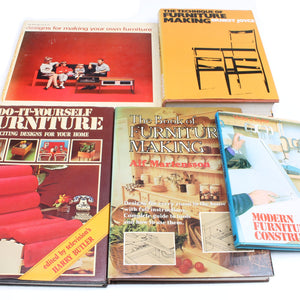 Collection of books on furniture making and design on a white background