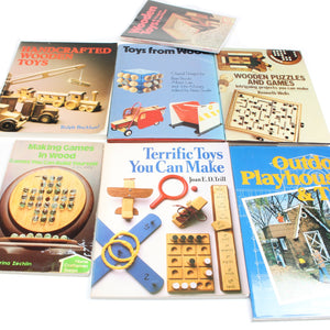 Collection of books on woodworking and toy making on a white background
