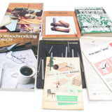 Collection of woodworking books on a white background